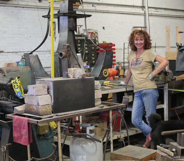 Jackie MacLeod shows off her work station within the Liberty Arts studio. (Staff Photo by: Naomi Marin-Rosario)