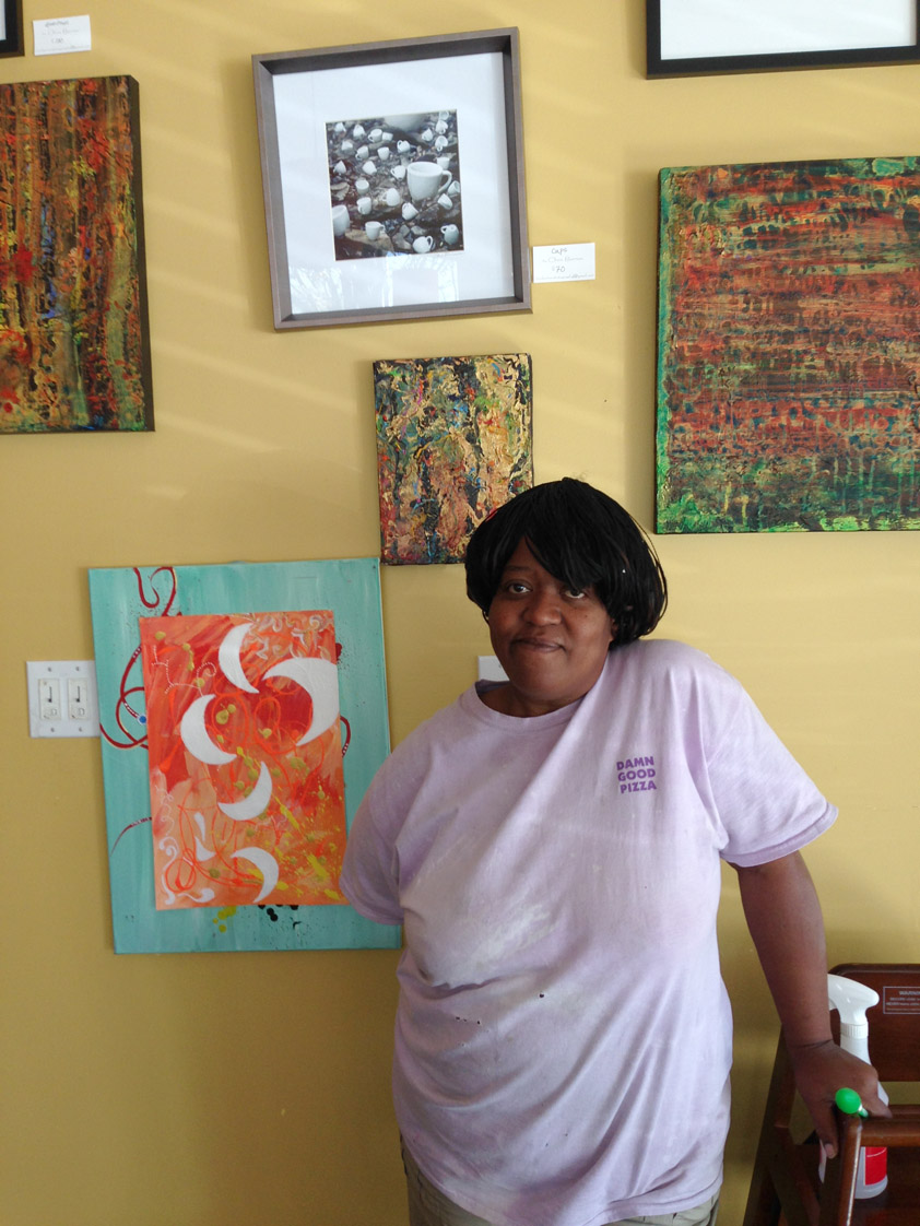 Carmen O’Neal poses with Lilly’s newest artwork.