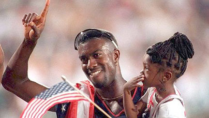 Allen Johnson holds up his daughter, Tristine, after winning the gold medal in the 110-meter hurdles in the 1996 Olympics in Atlanta. (Contributed by Tristine Johnson)