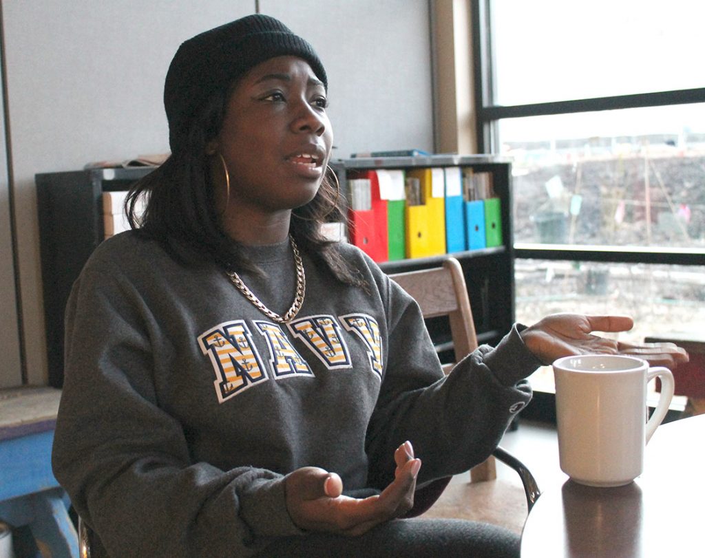 With her daily tea nearby, Latasha McMillan reflects on her experiences at SEEDS. (Staff photo by Parth Shah)