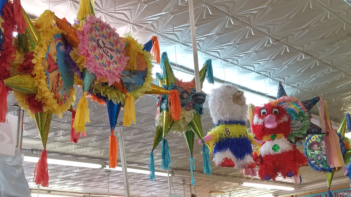 In addition to being a full supermarket, Los Primos carries piñatas, to make every kid’s birthday party fun. (Staff photo by Christina Herring)