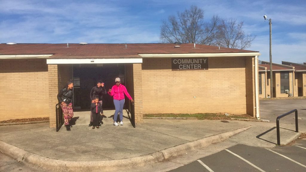 Although closed now, children such as Shamia Lewis, Shaneeka Cox, Amiya Wilds, and Zania Council still hang around the community center where the teen center is going to be placed. Shamia says she's excited to hear about the coming of a teen center. (Staff photo by Candice Craig)