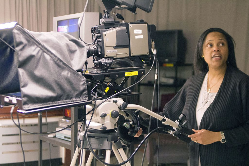 Felicia Casey-Hicks, NCCU TV studio manager, shows the PYO interns how to frame a subject in a camera shot. There are three main cameras in the studio –cameras 1, 2 and 3 – all of which shoot from different vantage points.