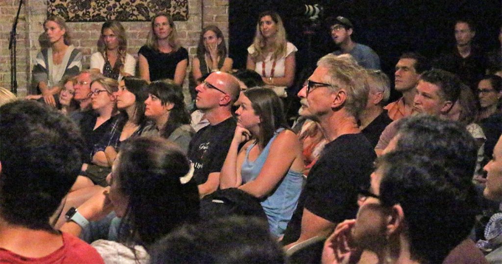  A packed crowd at Motorco listened intently as eight storytellers used the theme “fear” to entertain and in some cases, shock. (Photo by Nijah McKinney).