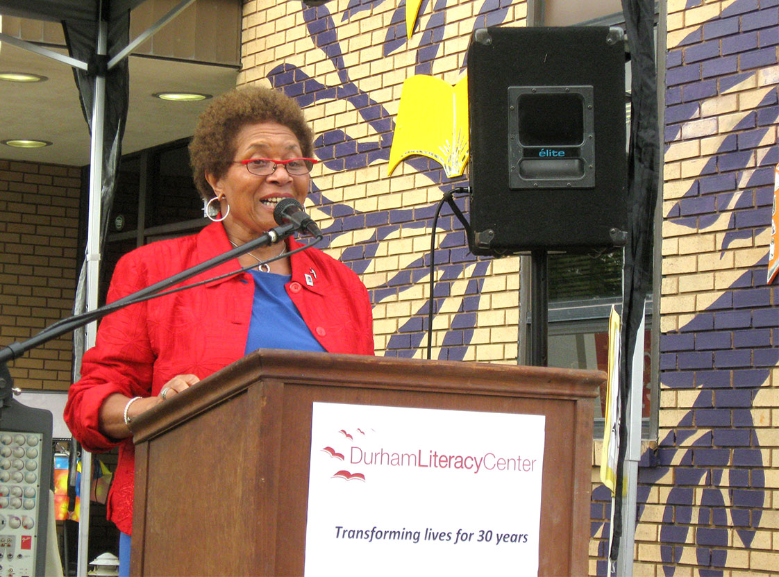 Cora Cole-McFadden reads a proclamation on behalf of the mayor, in celebration of the achievements of the Durham Literacy Center. Sept. 28, 2016 marked the DLC’s 30th anniversary, where staff, volunteers, local government officials, students and community members gathered to watch the unveiling of the DLC’s new mural. (Staff photo by Riley Turner)